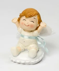 Figura bebé Pop and Fun sentada en cojín con 3 peladillas de chocolate